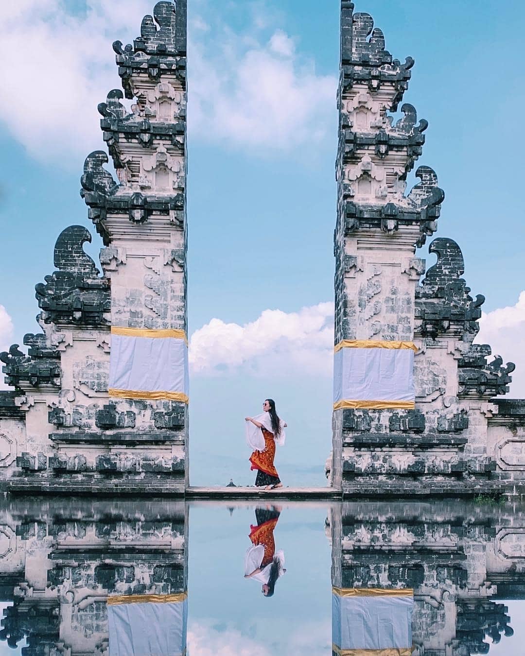how to avoid overtourism, girl standing at heaven's gate in bali