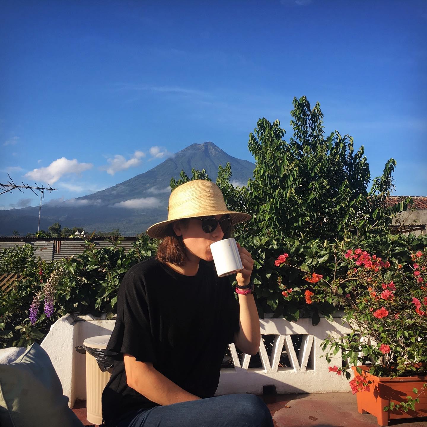 best independent hostels, girl drinking coffee on the roof terrace at Barbara’s Boutique hostel, Antigua, Guatemala