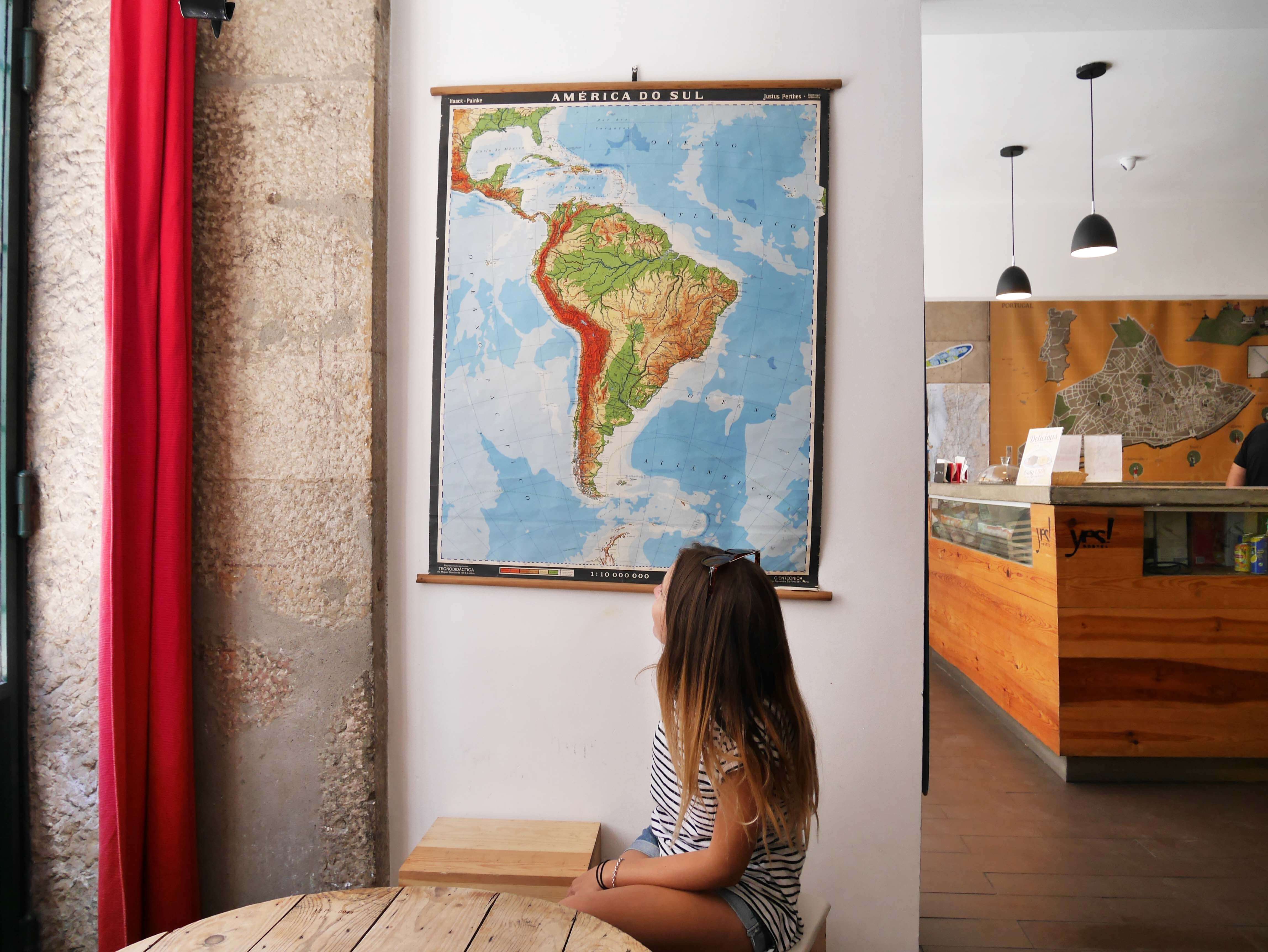 what is a hostel, Yes! Lisbon Hostel in Portugal girl looking at map